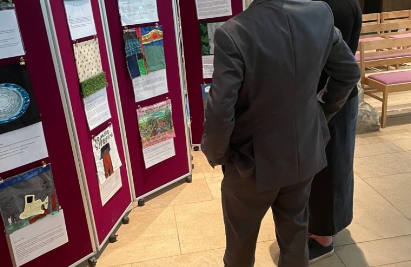 Rob Butler views the exhibits with Vicar Sally Moring