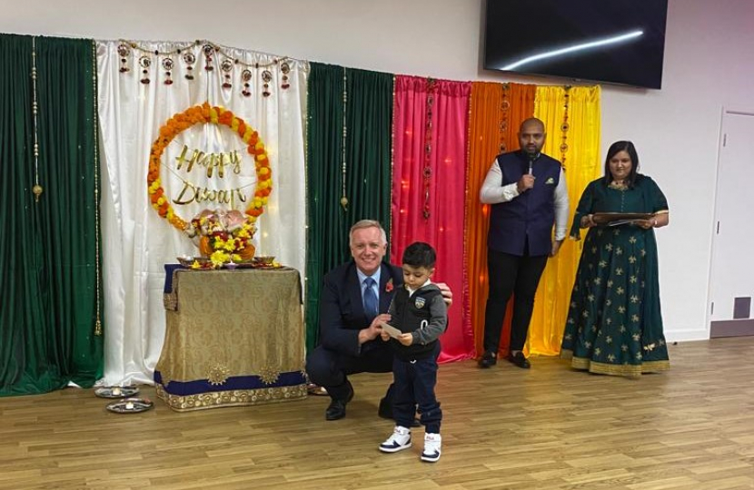 Rob presenting a prize at the Diwali event